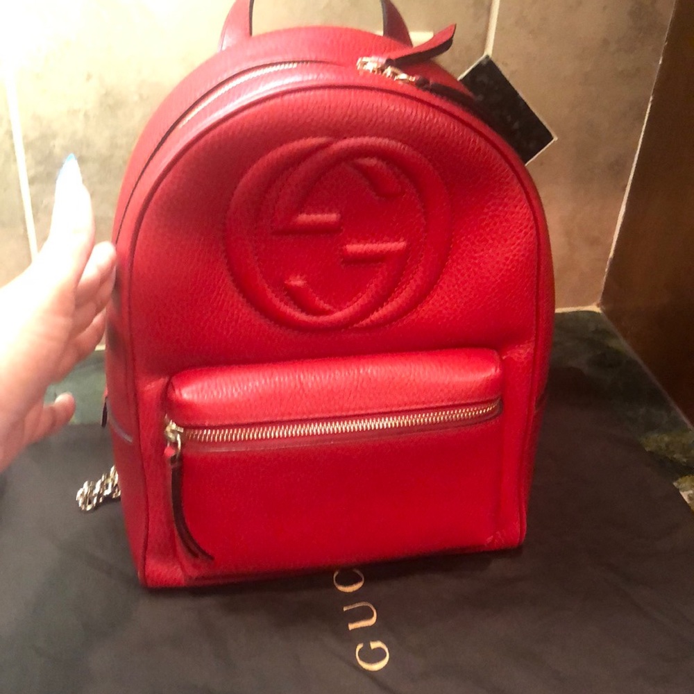 Authentic Gucci red pebble leather backpack with gorgeous chain straps!